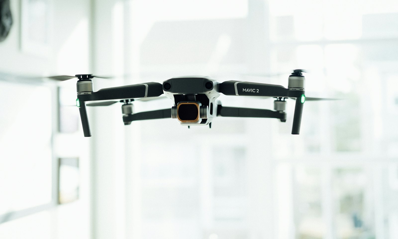 Professional drone with a gimbal camera in flight.